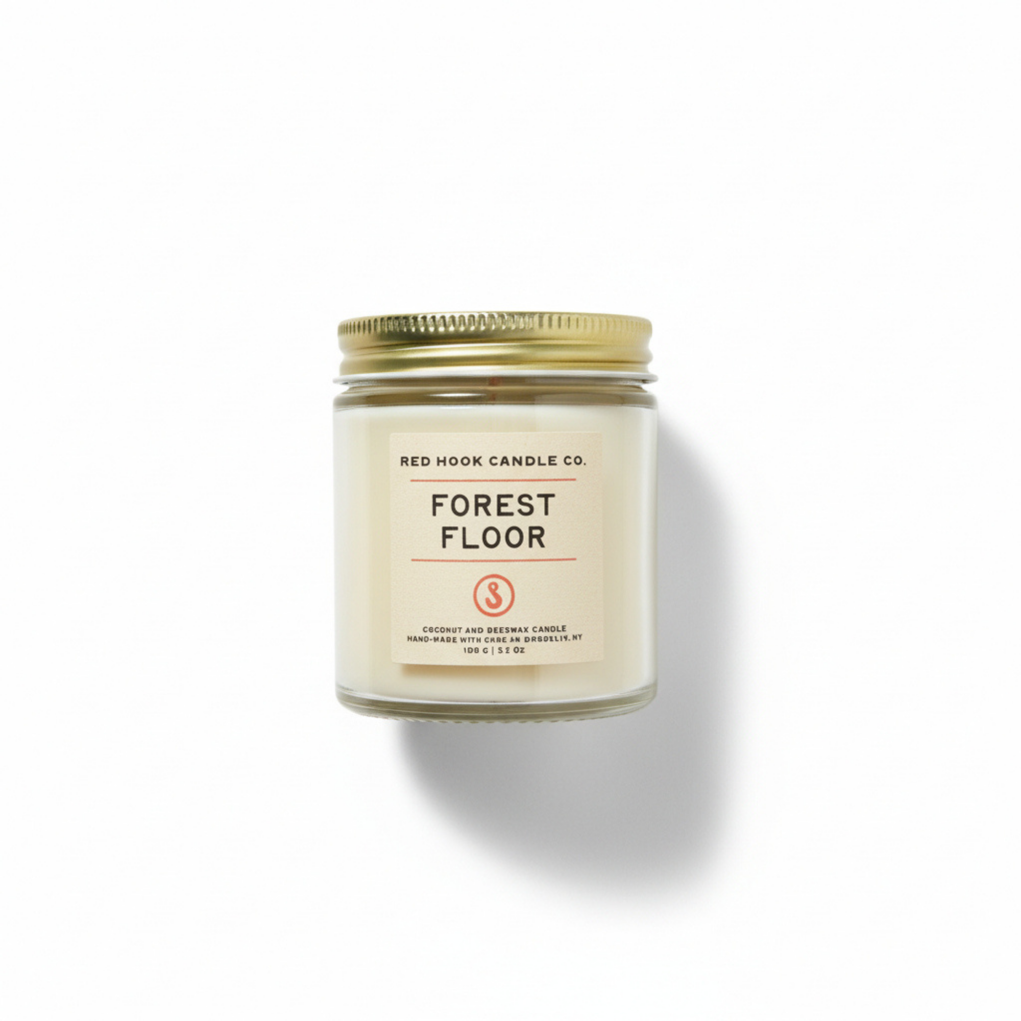 Candle jar labeled 'Forest Floor' by Red Hook Candle Co. on a white background