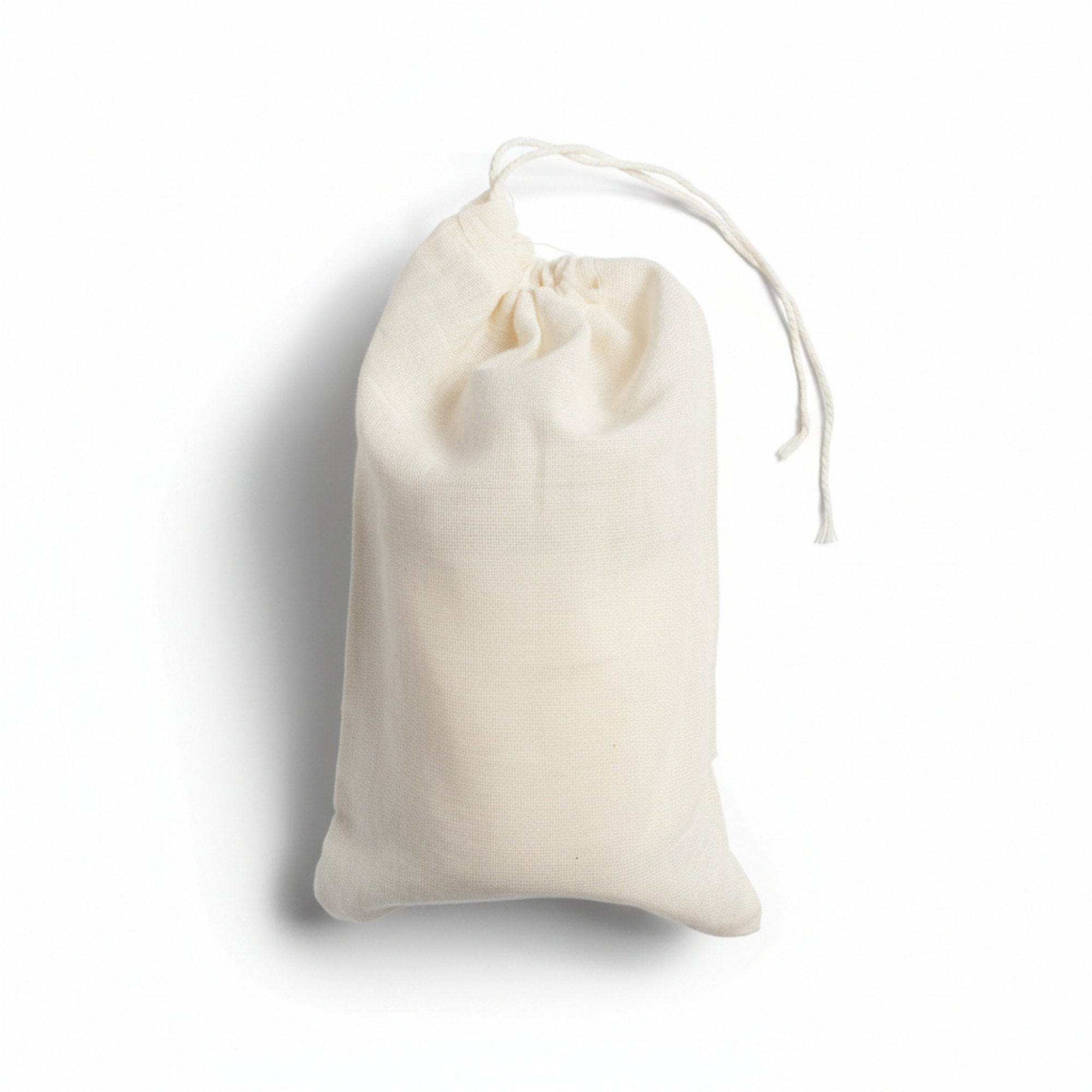 White drawstring bag on a white background. The candle is in its packaging.